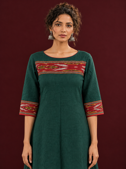 Elegant Bottle Green Cotton Dress with Contrast Maroon Ikat Yoke and Sleeve Border — styled view