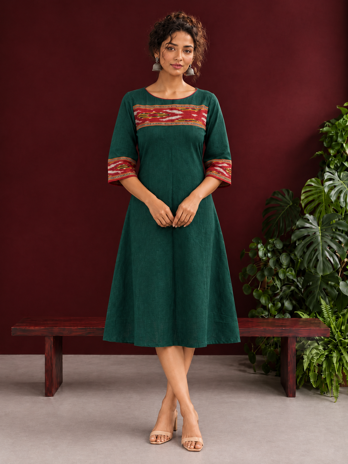 Elegant Bottle Green Cotton Dress with Contrast Maroon Ikat Yoke and Sleeve Border — front view — view 2