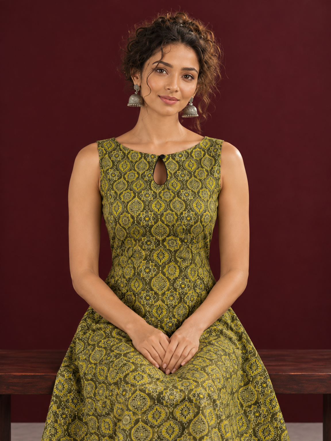 Olive Green Cotton A-Line Dress with Mustard Yellow Ajrakh Print and Keyhole Neckline — seated detail — view 5