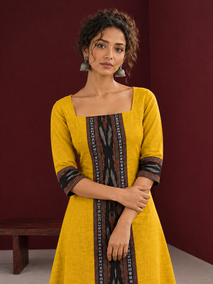 Vibrant Mustard Cotton A-line Dress with Contrast Ikat Front Panel & Coordinated Sleeve Cuffs — styled view