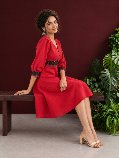 Vibrant Red Cotton Fit & Flare Dress with Contrast Black Ikat Waistband & Matching Cuffs — seated
