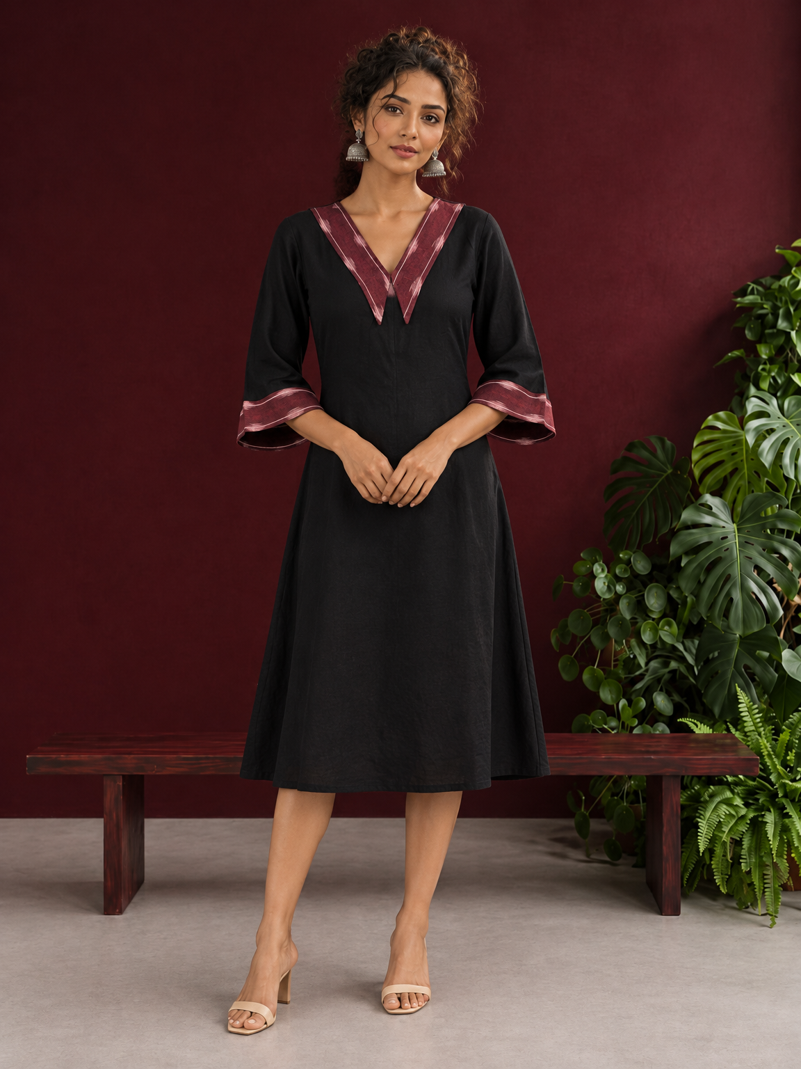 Classic Black Cotton A-line Dress with Contrast Maroon Ikat Collar and Matching Sleeve Cuffs — front view