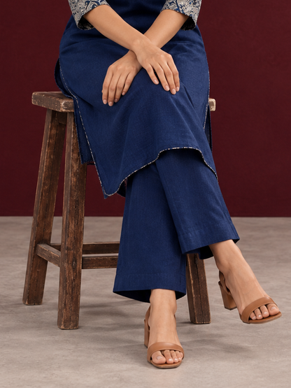 Navy blue cotton straight pants — seated