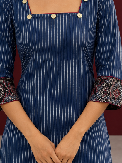 Maroon cotton pants with flowy silhouette — fabric detail