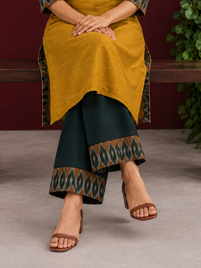 Bottle green cotton silk pant with Ikat border — seated — view 6