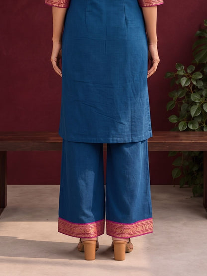 Elegant Peacock blue cotton silk pant with pink zari border — back view
