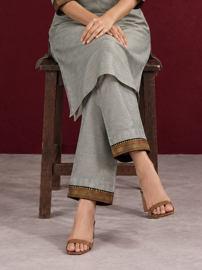 Elegant Sage Green Silk Kurta with Black zari Paisley Yoke & Contrast Sleeve Cuffs — Pant — seated