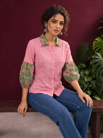 Vibrant Pink Cotton Shirt with Contrast Green Floral Print Collar and Balloon Sleeves — seated