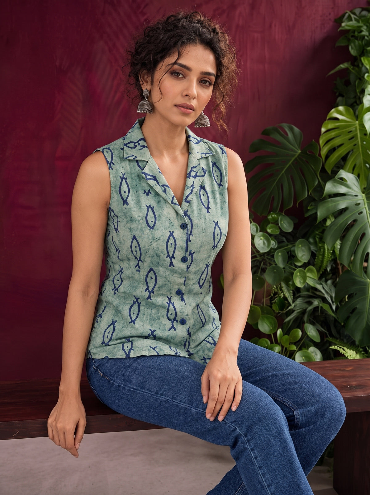 Blue Printed Cotton Sleeveless Shirt with Fish Motif & Collared Neckline — seated — view 3
