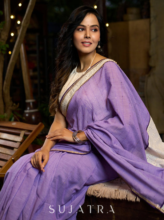 Elegant lilac cotton saree with golden accents and soft handcrafted sophistication
