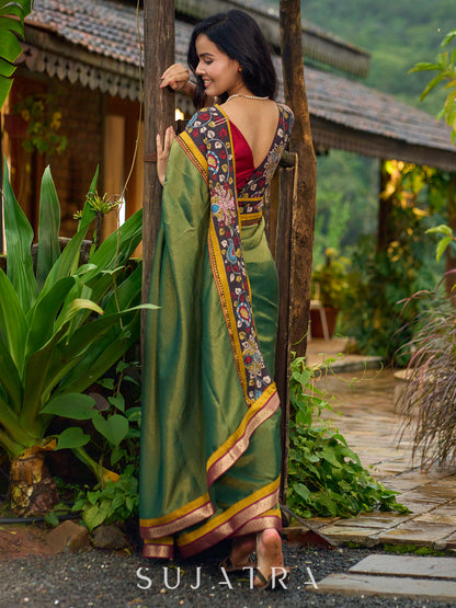Exclusive green tissue saree with hand painted kalamkari borders & maharashtrian khun border