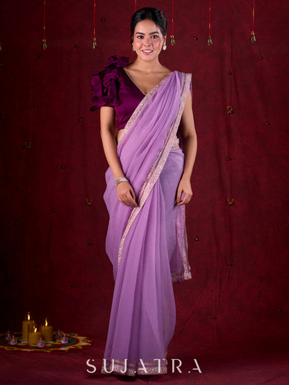 Soft Lavender Crepe Saree Adorned with Delicate Embroidered Lace Border