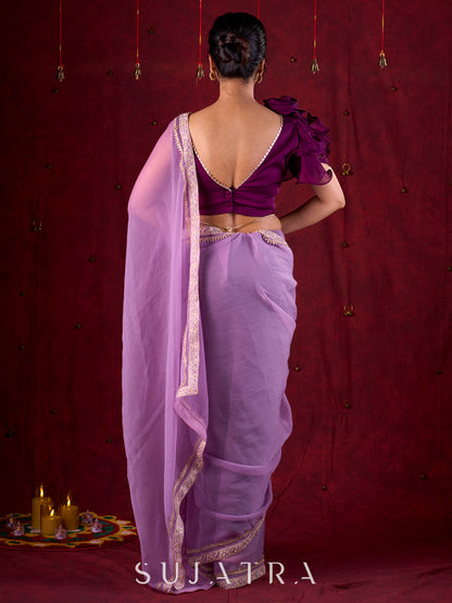 Soft Lavender Crepe Saree Adorned with Delicate Embroidered Lace Border
