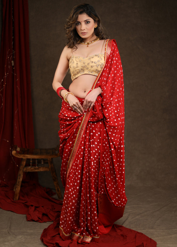 Radiant Red Bandhej Saree with Delicate Gold And Banarasi Detailing