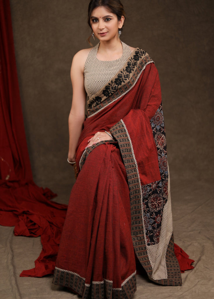 Graceful Maroon Cotton Ajrakh Combination Saree Highlighted with Floral Embroidery