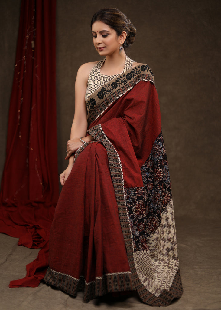 Graceful Maroon Cotton Ajrakh Combination Saree Highlighted with Floral Embroidery