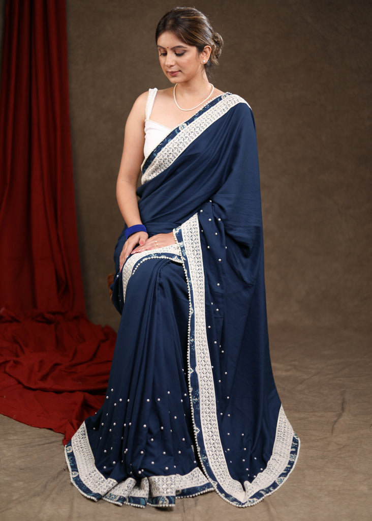 Elegant Ocean Blue Rayon Saree Highlighted with Moti Work & Beautiful Lace Detailing