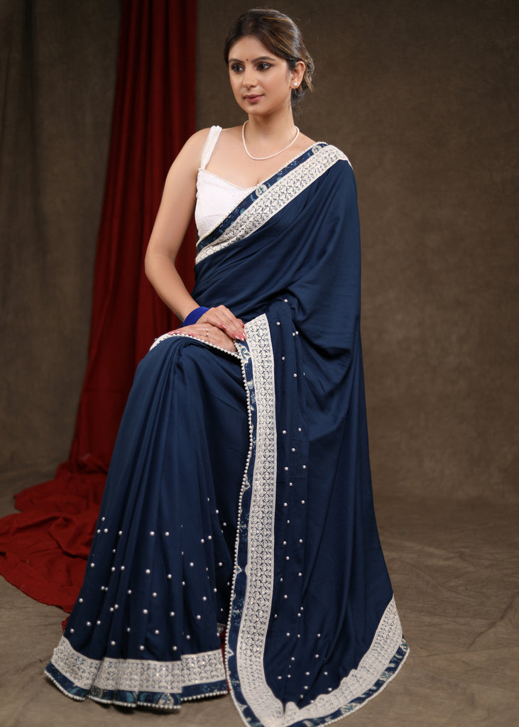 Elegant Ocean Blue Rayon Saree Highlighted with Moti Work & Beautiful Lace Detailing