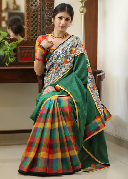 Standout checks Cotton saree adorned with Madhubani hand painted border.