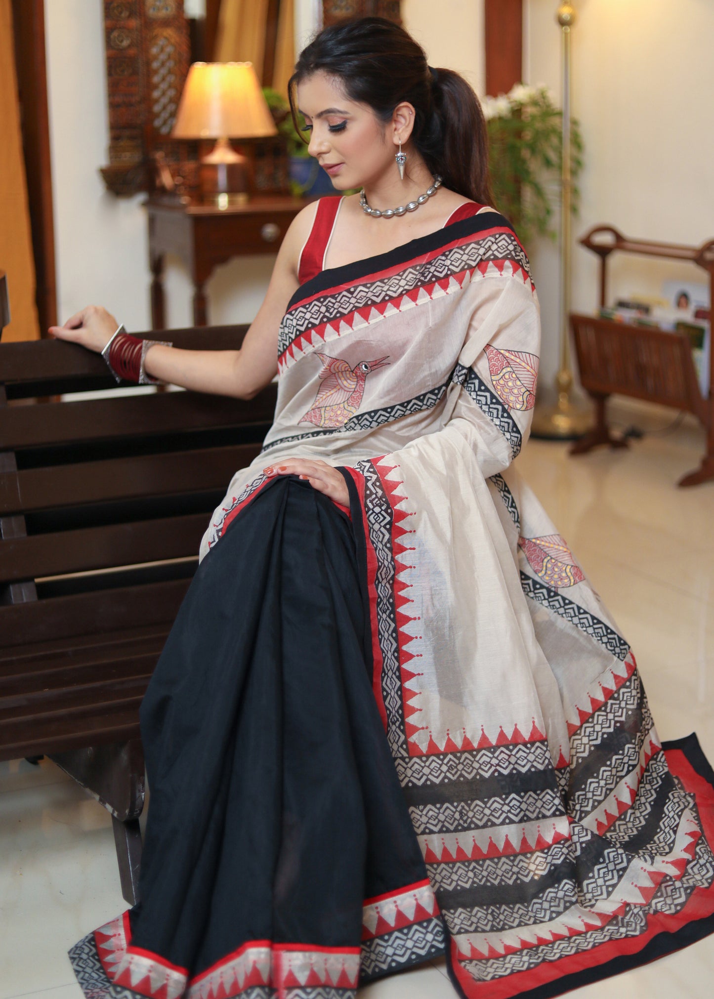 Graceful black Chanderi saree with elegant hand painted Pallu and border