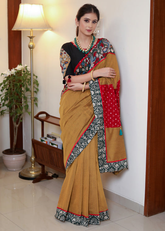 Beautiful mustard Cotton saree with Kalamkari hand painted border, red Bandhani Pallu and tassels