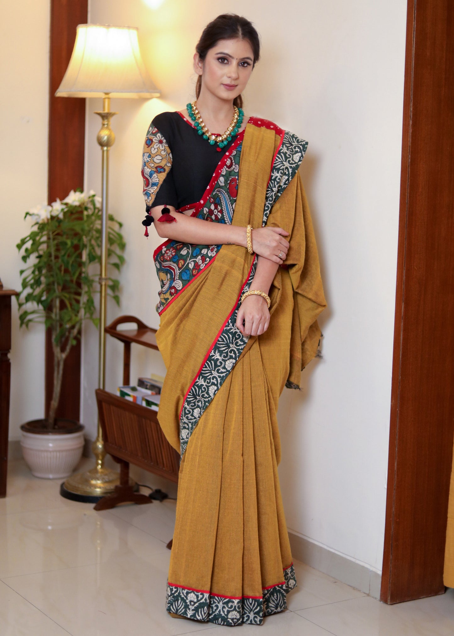 Beautiful mustard Cotton saree with Kalamkari hand painted border, red Bandhani Pallu and tassels