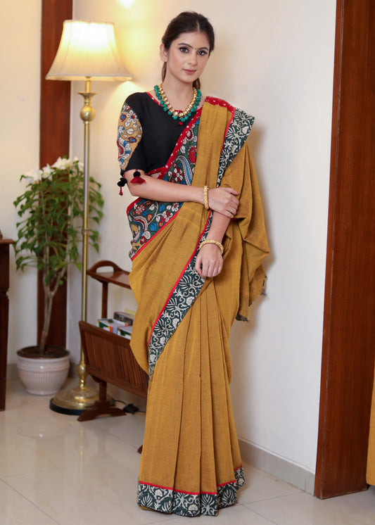 Beautiful mustard Cotton saree with Kalamkari hand painted border, red Bandhani Pallu and tassels