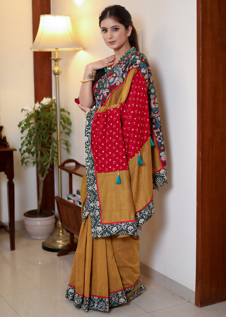 Beautiful mustard Cotton saree with Kalamkari hand painted border, red Bandhani Pallu and tassels