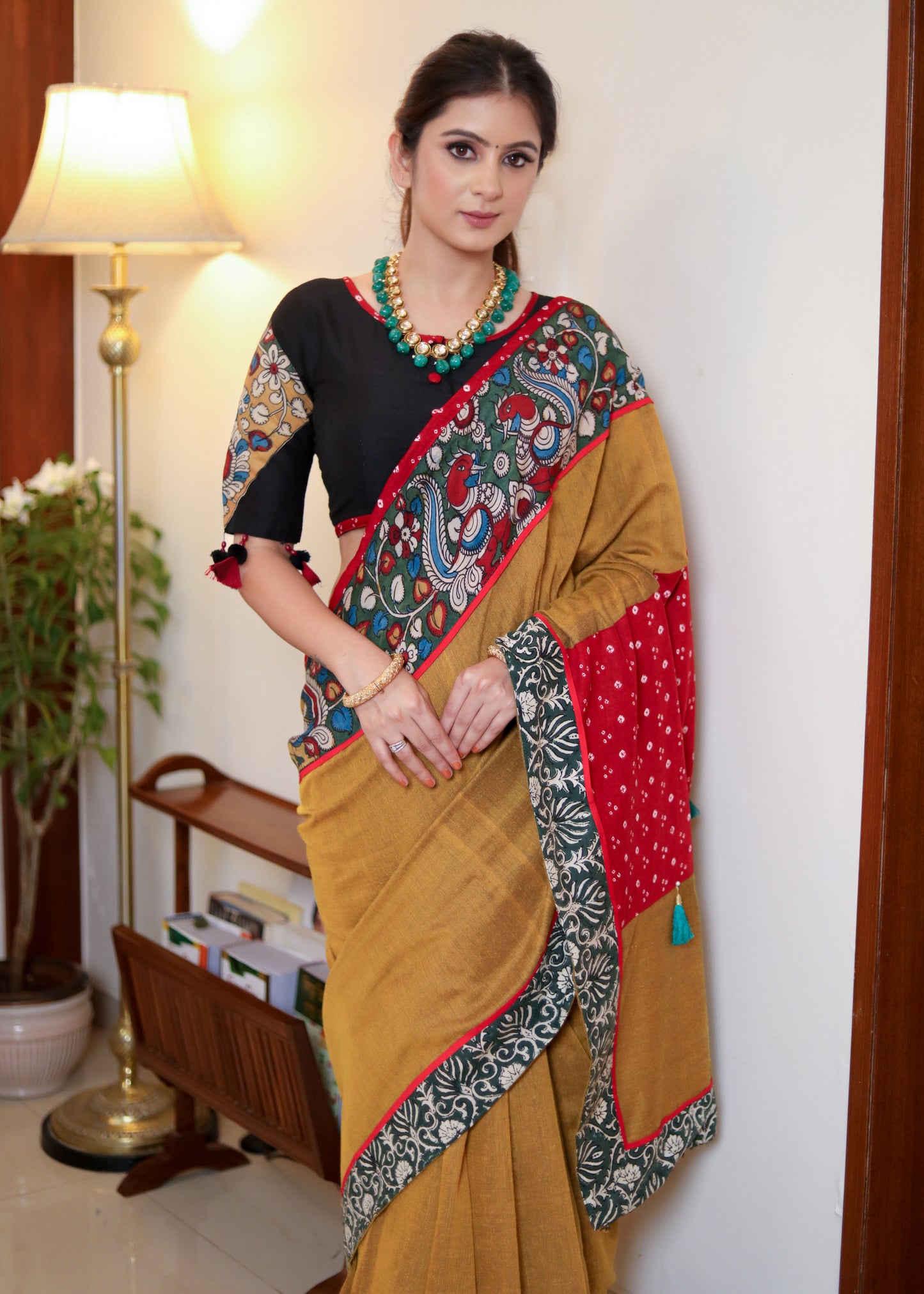 Beautiful mustard Cotton saree with Kalamkari hand painted border, red Bandhani Pallu and tassels