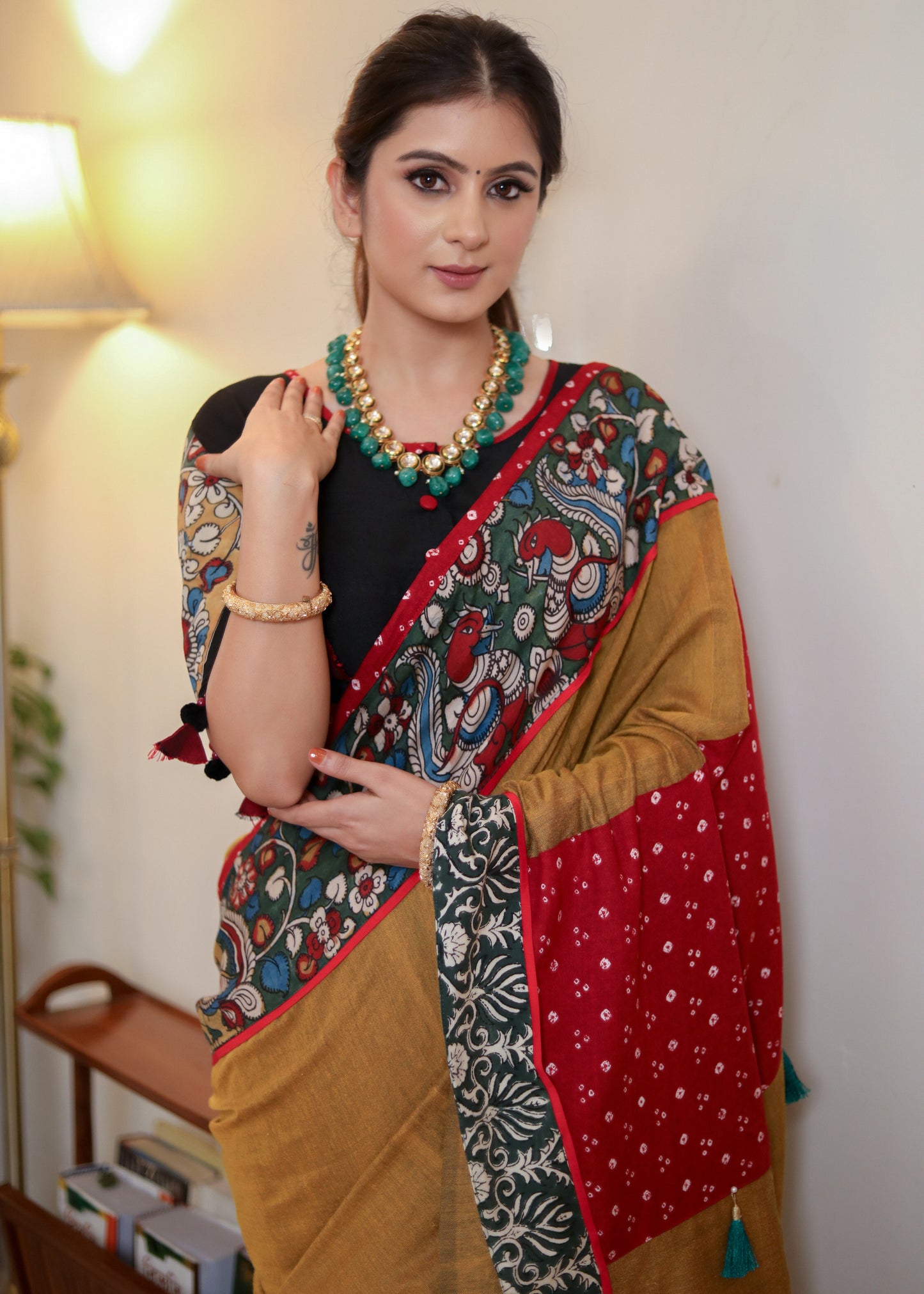 Beautiful mustard Cotton saree with Kalamkari hand painted border, red Bandhani Pallu and tassels