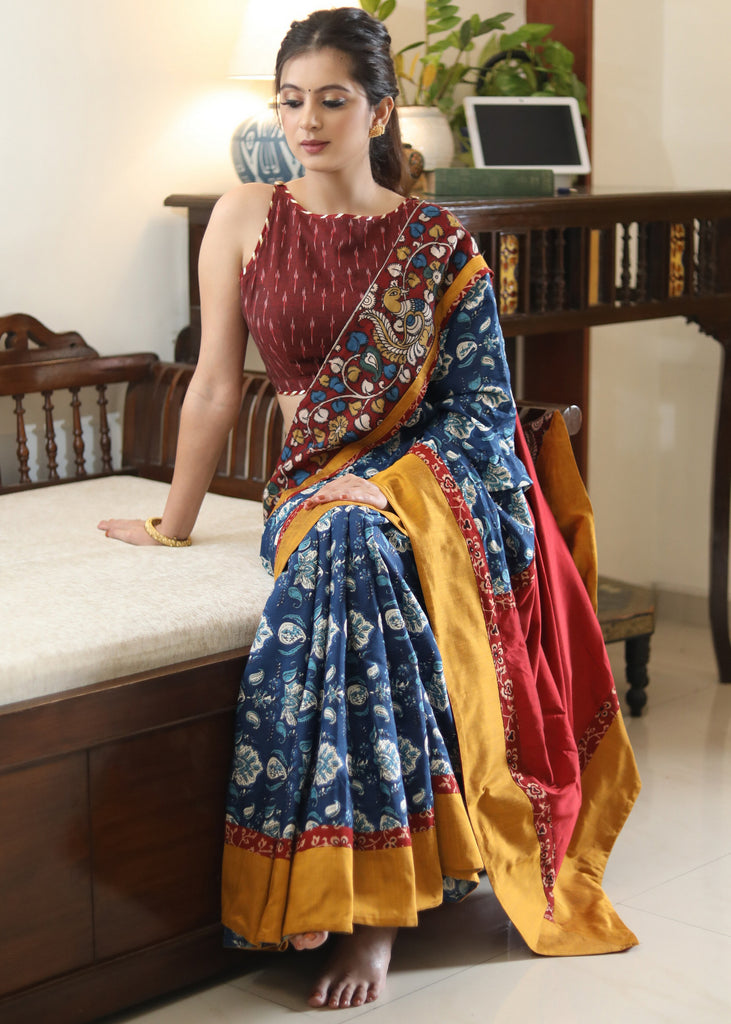 Lustrous blue printed saree graceful Madhubani painted Pallu with maroon and mustard border