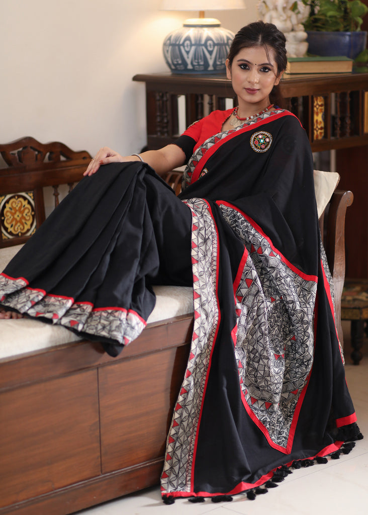 Regal black Cotton saree with Madhubani painted Pallu and border highlighted with mirror work