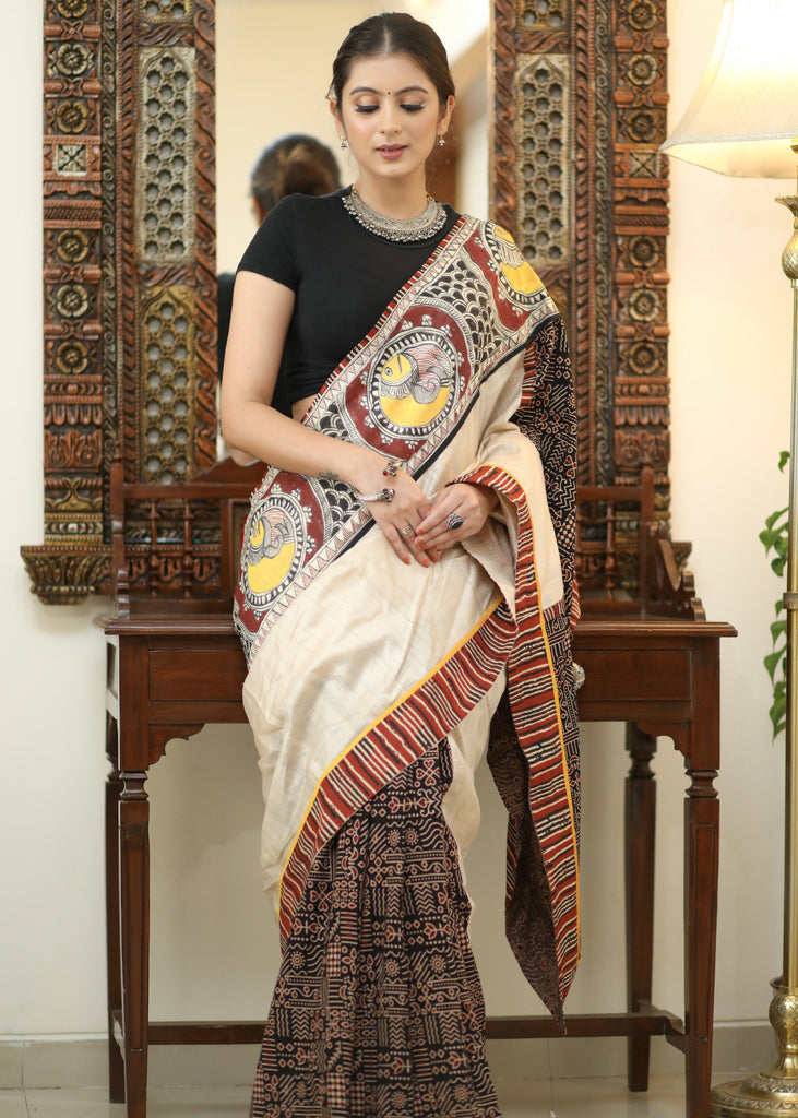Elegant Cotton Ajrakh saree with Chanderi Pallu adorned with Madhubani painting.