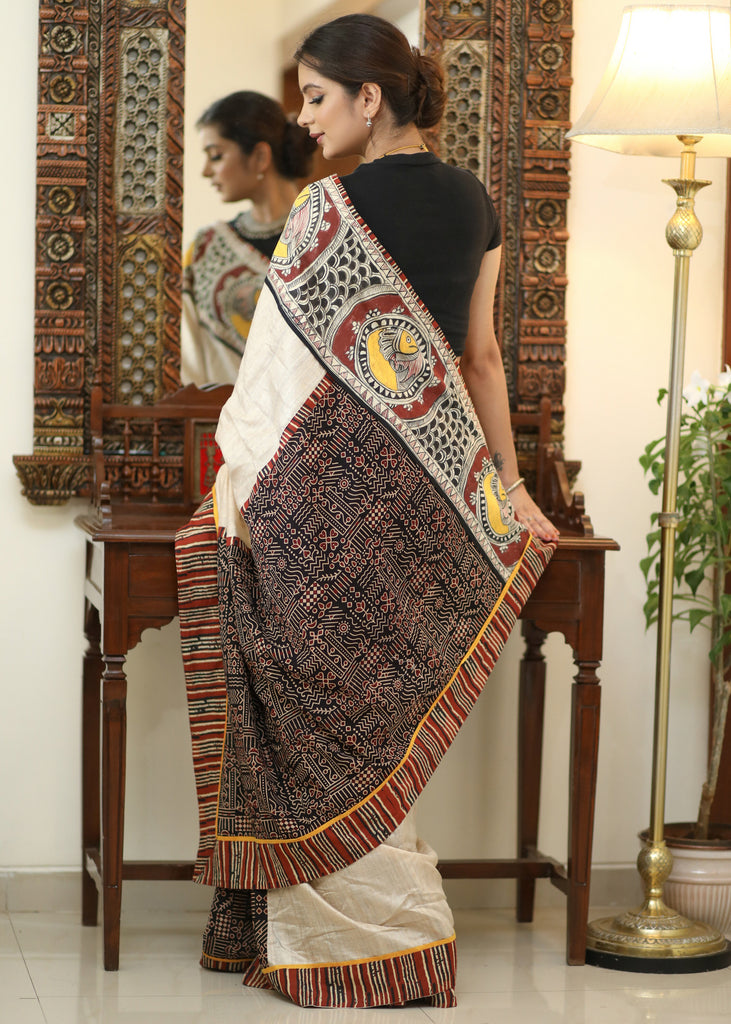 Elegant Cotton Ajrakh saree with Chanderi Pallu adorned with Madhubani painting.