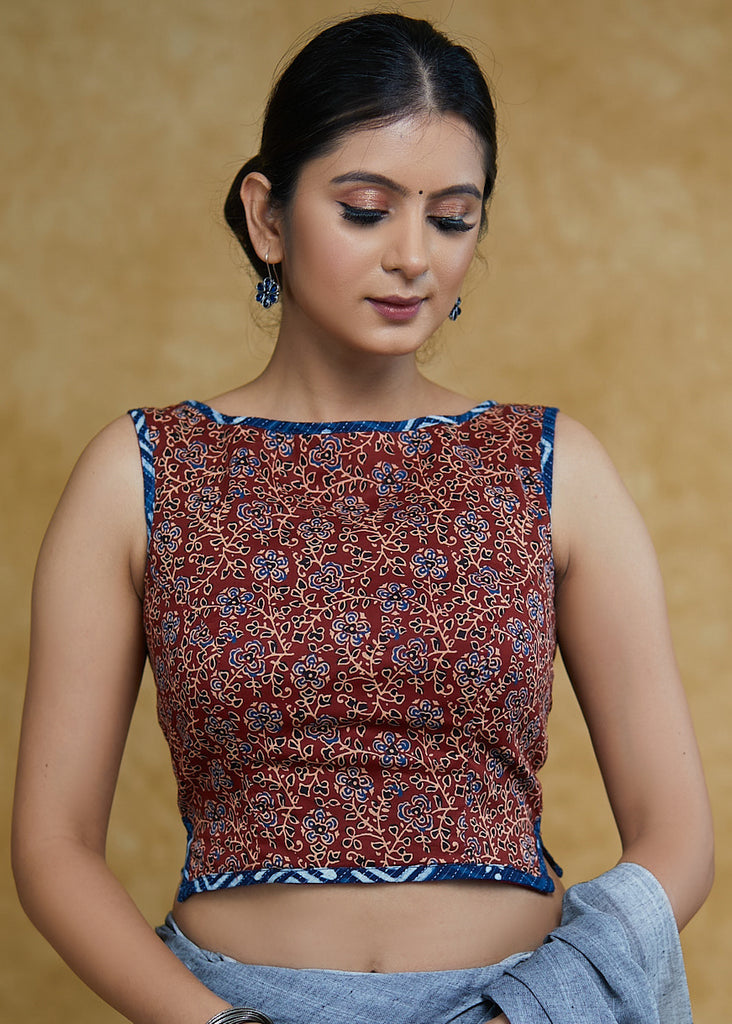 Exclusive Maroon Floral Ajrakh Boat Neck Sleeveless Blouse with Indigo Piping