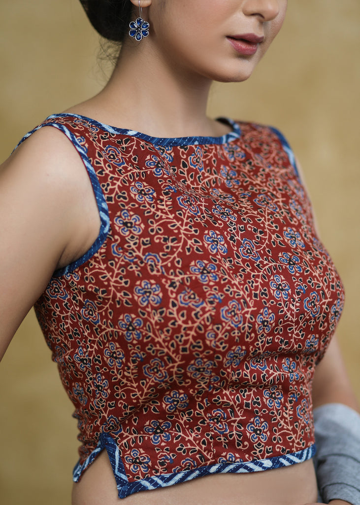 Exclusive Maroon Floral Ajrakh Boat Neck Sleeveless Blouse with Indigo Piping