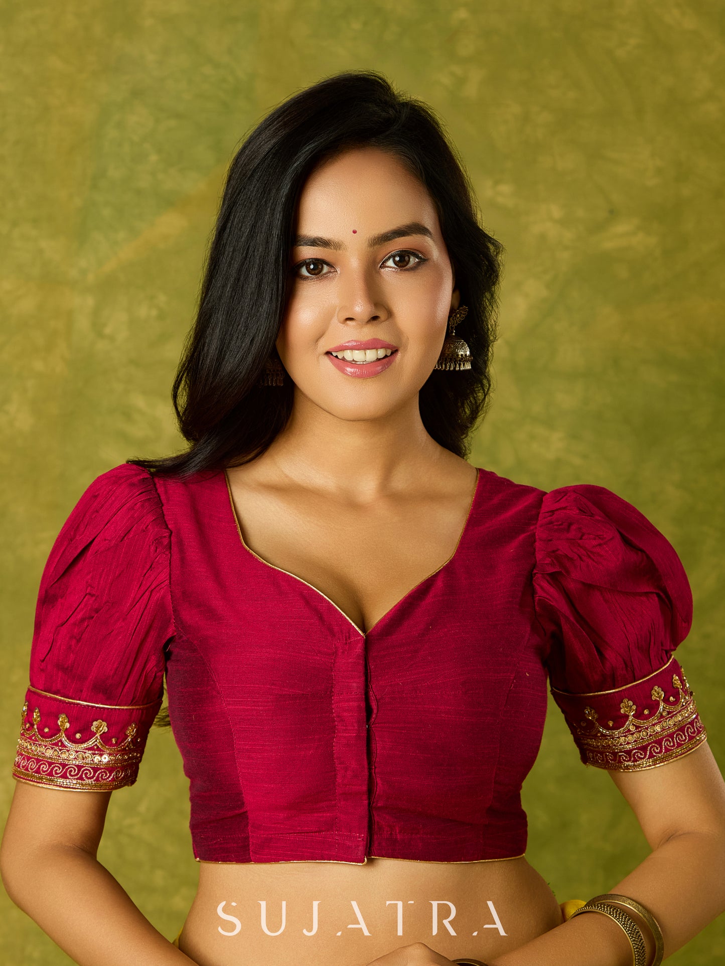 Elegant hand embroidered festive blouse in dark magenta cotton silk.
