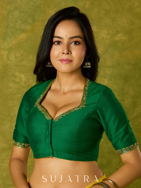 Gracefully hand embroidered forest green cotton silk blouse.