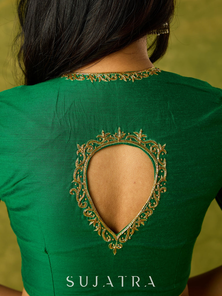 Gracefully hand embroidered forest green cotton silk blouse.