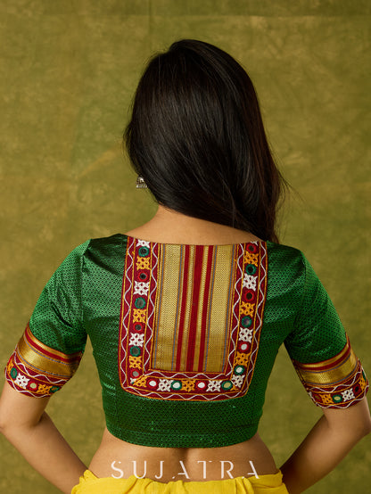 Elegant green khun blouse exuding festive flair and tradition.
