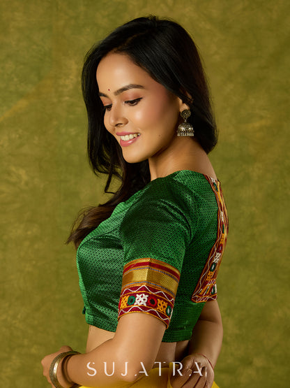 Elegant green khun blouse exuding festive flair and tradition.