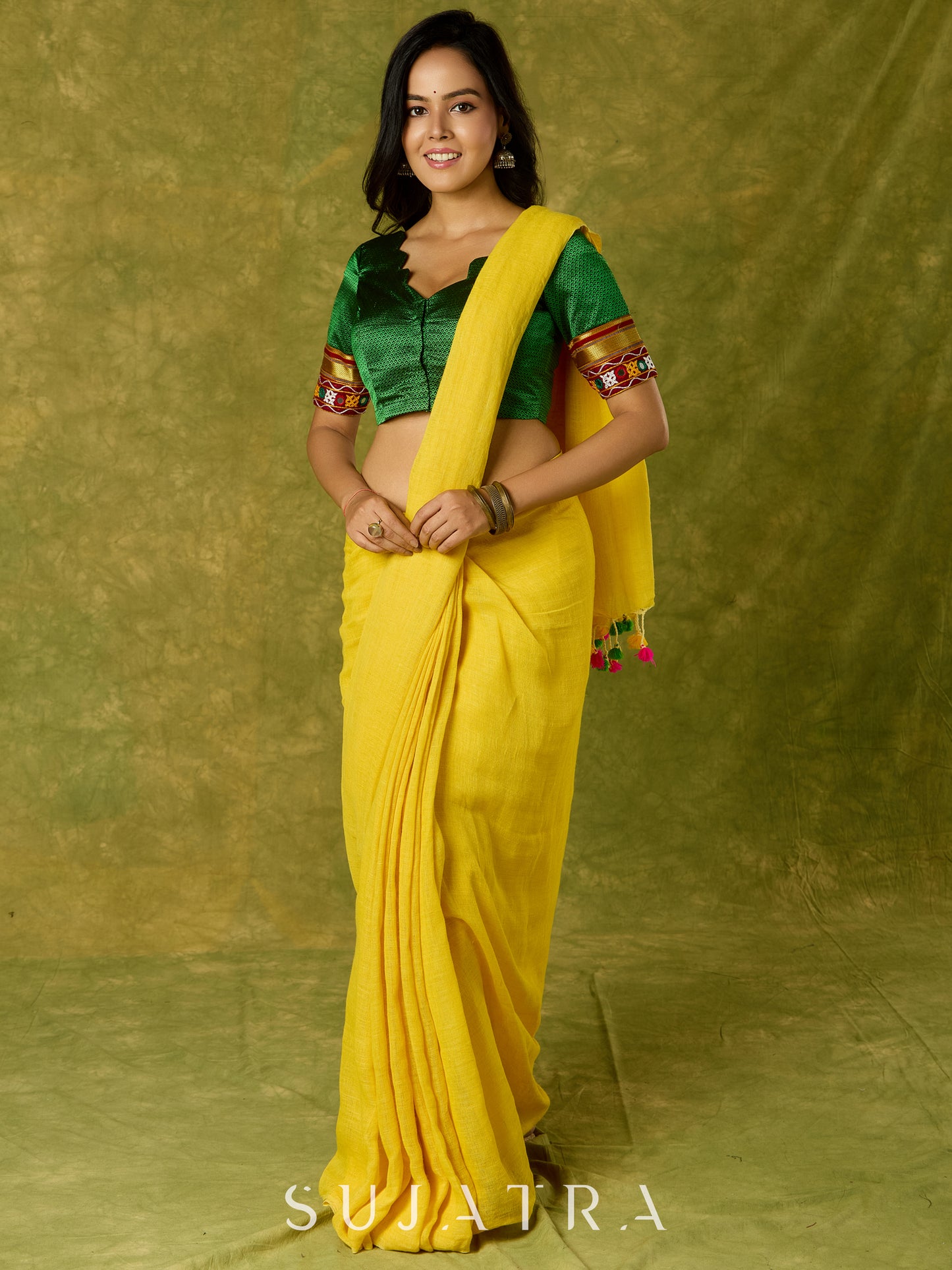 Elegant green khun blouse exuding festive flair and tradition.