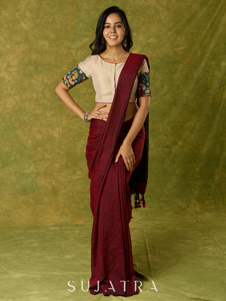 Beige cotton silk blouse beautifully blended with artistic kalamkari detailing.