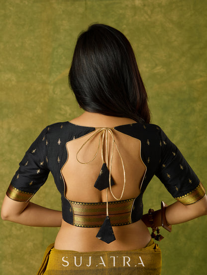 Festive charm in black self-butti cotton silk blouse.