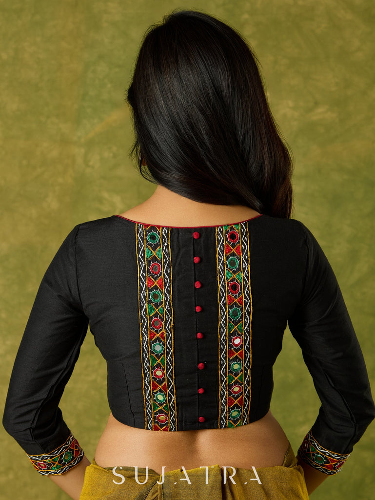 Black cotton silk blouse with intricate Kutch mirror work.