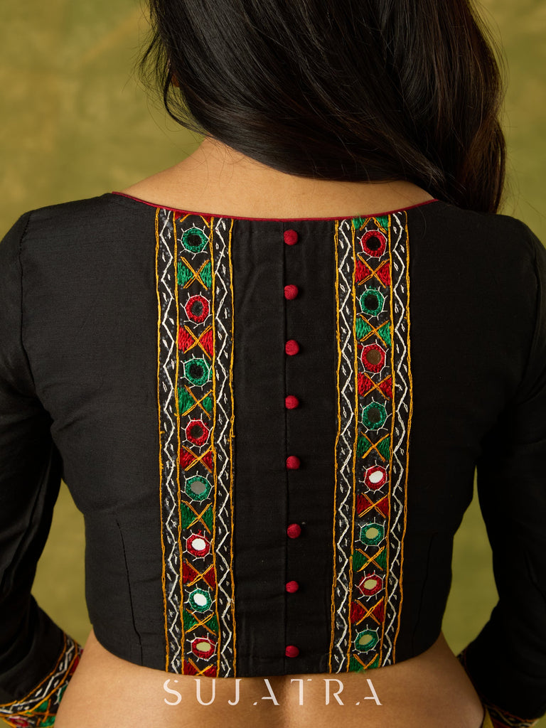 Black cotton silk blouse with intricate Kutch mirror work.