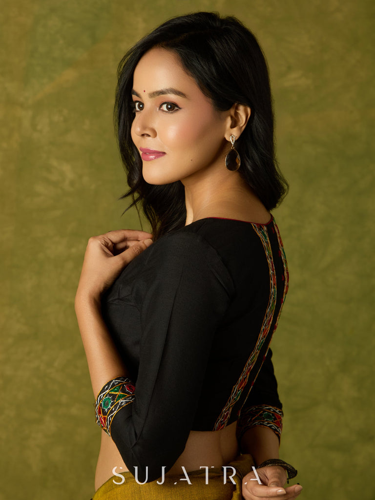 Black cotton silk blouse with intricate Kutch mirror work.