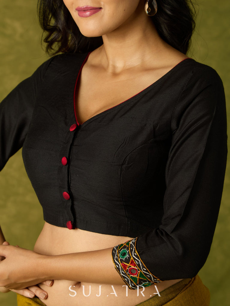 Black cotton silk blouse with intricate Kutch mirror work.