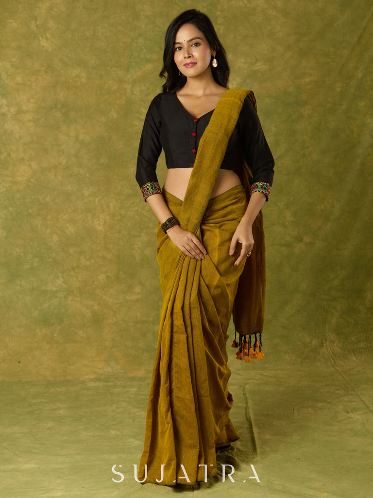 Black cotton silk blouse with intricate Kutch mirror work.