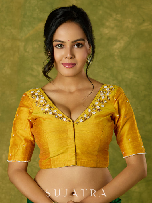 Beautifully hand embroidered light yellow cotton silk blouse for festivals.